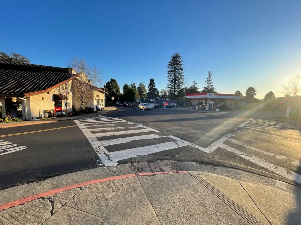 Wide angle shot of crosswalks and businesses in Kensington, California.